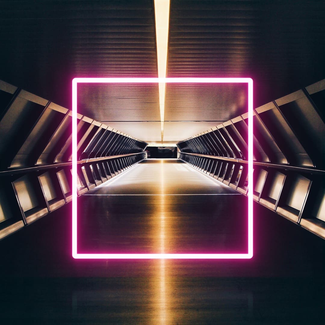 A modern hallway with polished floors and illuminated walls leads to a distant point, framed by a bright pink neon square.