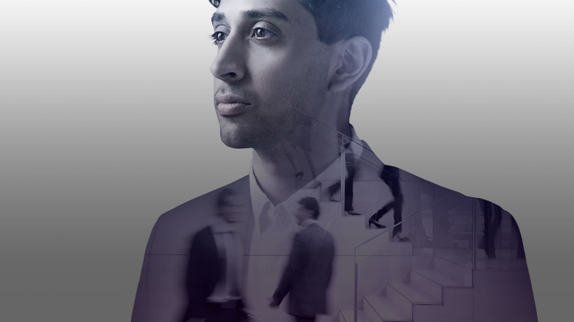 Man in suit with double exposure effect showing silhouettes overlaid on his torso, looking upward thoughtfully
